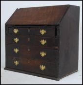 A Georgian 18th century mahogany bureau having appointed interior within raised over bank of