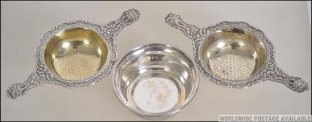 A pair of vintage silver plated Prima NS tea strainers,