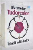 A retro 20th century illuminated shop exterior advertising wall clock with notation for ' Tudor