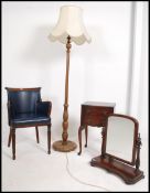 A Regency style mahogany and faux blue leather library armchair raised on reeded legs together with
