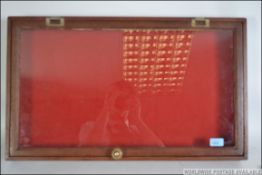 A good early 20th century mahogany jewellery -fair display cabinet with hinged glazed top and lined