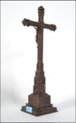 A 19th century carved oak crucifix - cross of eclesiastical origins having applied copper figure of