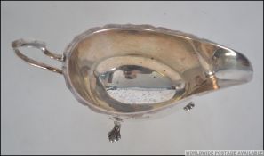 A silver hallmarked creamer - pourer bearing hallmarks for Sheffield by Francis Howard Ltd,1961.