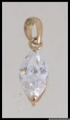 A 9ct gold and marquise cut necklace pendant.