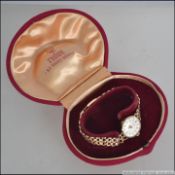 An 9ct gold vintage ladies Rolex Tudor Royal wristwatch / dress watch set to an 9ct bracelet,