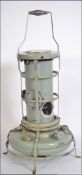 A vintage 1950's Aladdin ' blue flame series 32 ' heater in the original paintwork complete with