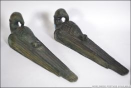 2 Art Deco style wooden wall plaques of birds with craned necks,