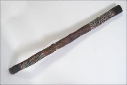 A traditional mid 20th century Aboriginal / Australian didgeridoo with painted animal and