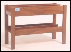 A 1970's Danish teak wood retro magazine rack - canterbury by Guy Rogers.