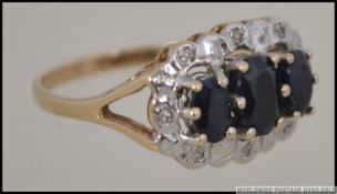 A 9ct gold diamond and sapphire 3 stone ring.