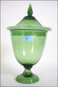 A late 19th century / 20th century hand blown green glass lidded urn shaped vase / sweet bon bon