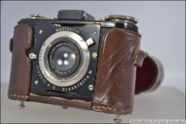 An early 20th century Plaubel Makinette Strut-Folding bellows camera of small size with Anticomar