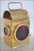 A mid century ER Royal cipher brass carriage travelling lamp of rectangular form with inset