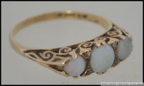 A 9ct gold vintage opal ladies 3 stone ring on gypsy setting. Hallmarked for London 1973. Size Q.