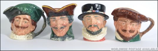 A collection of four large early ceramic Royal Doulton Toby Jug's.