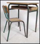A 1950's vintage mid century tubular metal and beech wood childs school desk and similar chair.