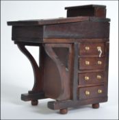 A 20th century Apprentice piece Victorian Davenport mahogany writing desk.