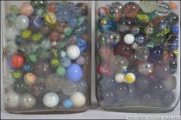 2 jars of marbles to include mainly 20th century. Spiral, helix etc.