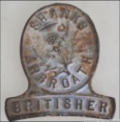 A vintage cast iron plaque for Shanks Arbroath Britisher Lawnmowers. Measures 14cms high.