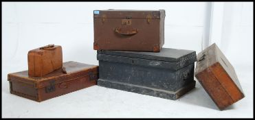 A collection of trunks, chests and suitcases to include a wooden tool chest with contents,