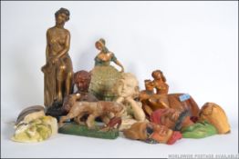 A collection of plaster figurines - masks dating from the 19th and 20th century to include
