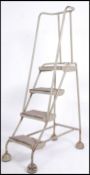 A stunning retro / vintage industrial mid 20th century metal tubular Library / factory ladder.