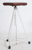 A mid century 20th century Industrial two tone machinists stool.