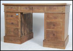An Edwardian walnut twin pedestal office writing desk ( for restoration ) The pedestals on plinth