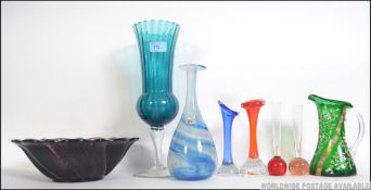 A collection of retro and vintage studio glass to include a green hand painted Victorian jug and a