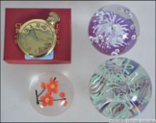 A collection of paperweights to include spiral helix, control bubble,