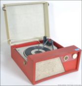 A vintage BSR record deck set in a red and cream vinyl case