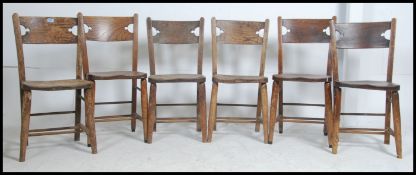 A set of 6 Victorian beech and elm windsor kitchen country dining chairs raised on turned legs with