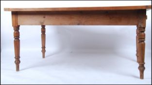A large 20th century country pine refectory dining table having twin end cutlery drawers,