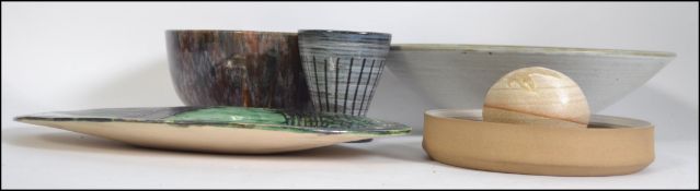 A good selection of studio pottery by various different makers to include bowls, vase,
