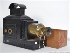 A 19th century magic lantern of metal and brass form together with a large collection of slides to