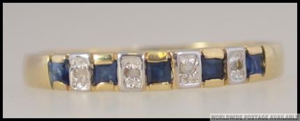 A 9ct / 375 marked ladies sapphire and diamond ring.