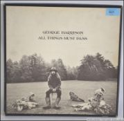 The Beatles - A George Harrison signed copy of ' All Things Must Pass ' in the original box / outer