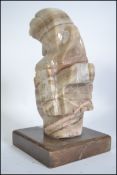 A possible South American / African style stone carving of a male deity on a square base please see