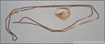 A 9ct gold signet ring having plain cartouche to front, shank split to the rear. Weight 4.0g.