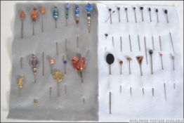 An excellent collection of 19th and 20th century hatpins to include ebonised head, silver,