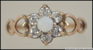 A 975 sterling gilt silver opal flower head cluster ring.