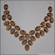 A large white metal 925 silver and smokey quartz necklace with hoop linked chain having bar and