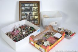 A large collection of costume jewellery from the 20th century to include cased necklaces, brooches,