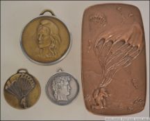 A group of three Bronze and silver metal parachute medals dating from the 1980's.