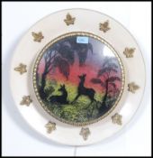 A 1950's retro Danish influenced wall lamp light having diorama of stag with northern lights to the