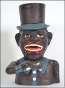 A 20th century cast iron Negro money box entitled The Jolly Nigger. Measures 20cm high.