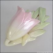 A Royal Worcester wall pocket in the form of a flower having vine and leaf back with green