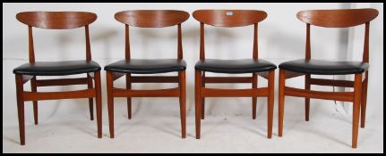 A good set of 4 1970's retro Danish teak propeller back dining chairs raised on turned legs with