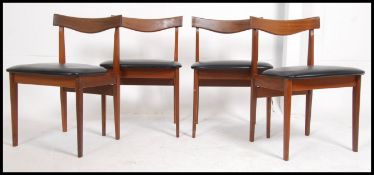 A set of 4 1970's teak and faux leather Danish influence ' propeller ' back dining chairs being