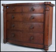 A Victorian Scottish bow front mahogany chest of drawers having knob handles with 2 short over 3